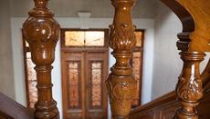 The nobility of the building is imprinted on the wooden railings.